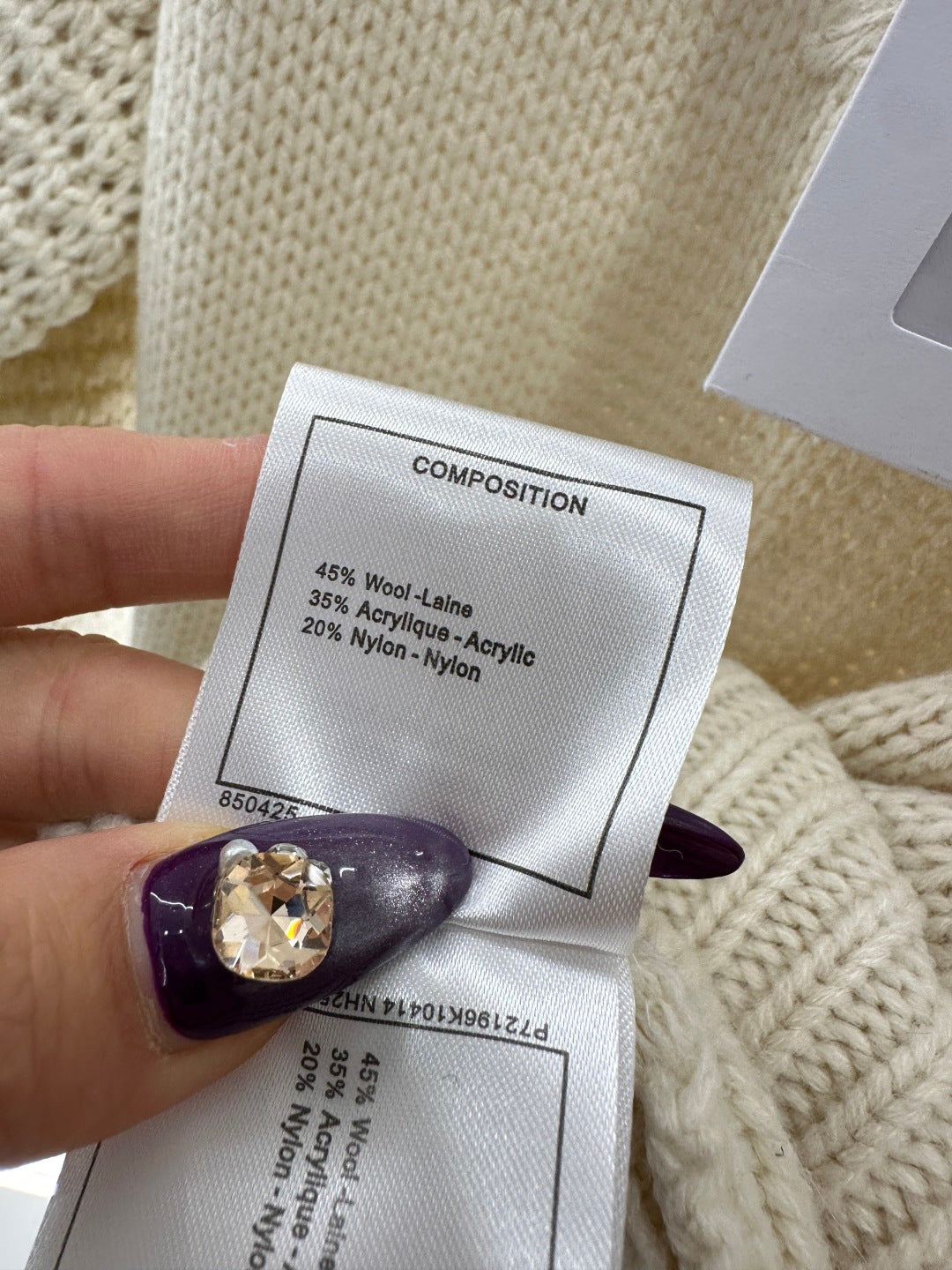 Knitted sweater with hook and loop design