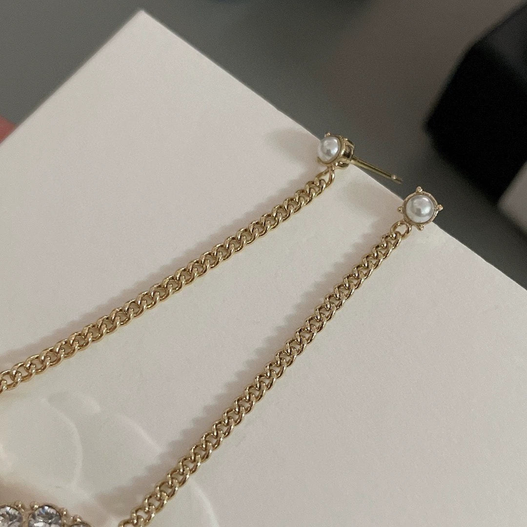 Long chain hanging double C-ear studs