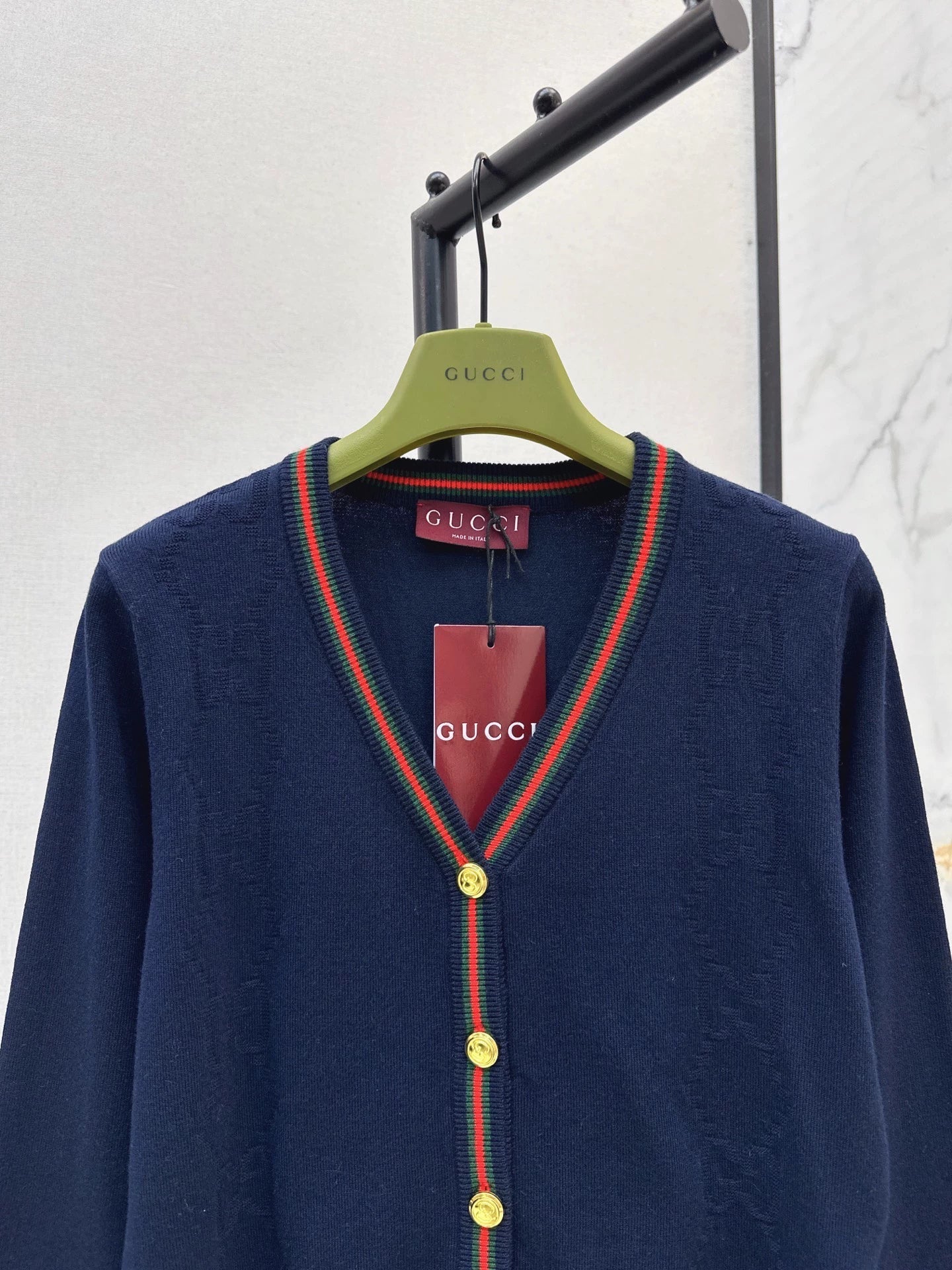 25 Knitted cardigan with woven pattern and V-neck