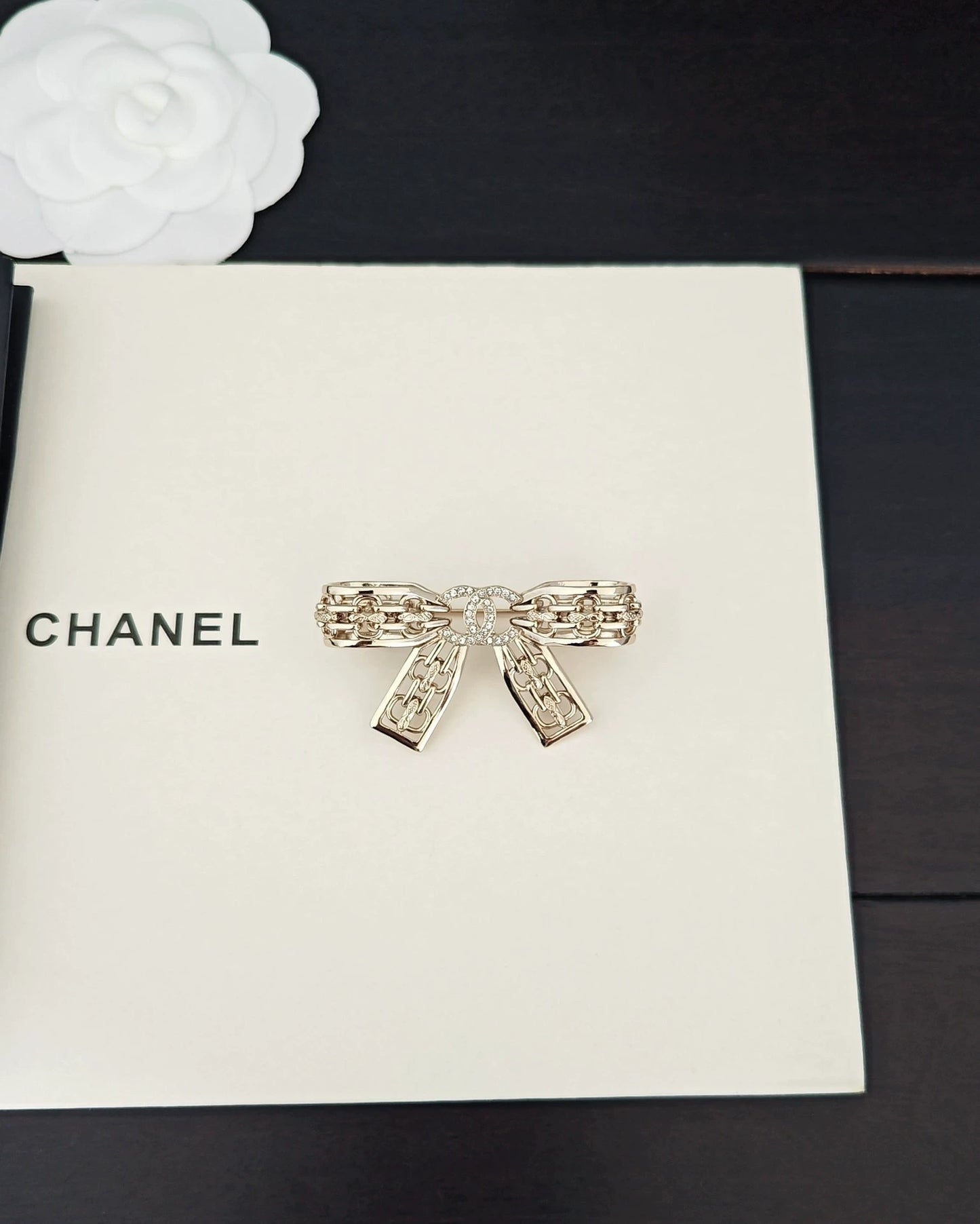 Light gold hollow bow brooch