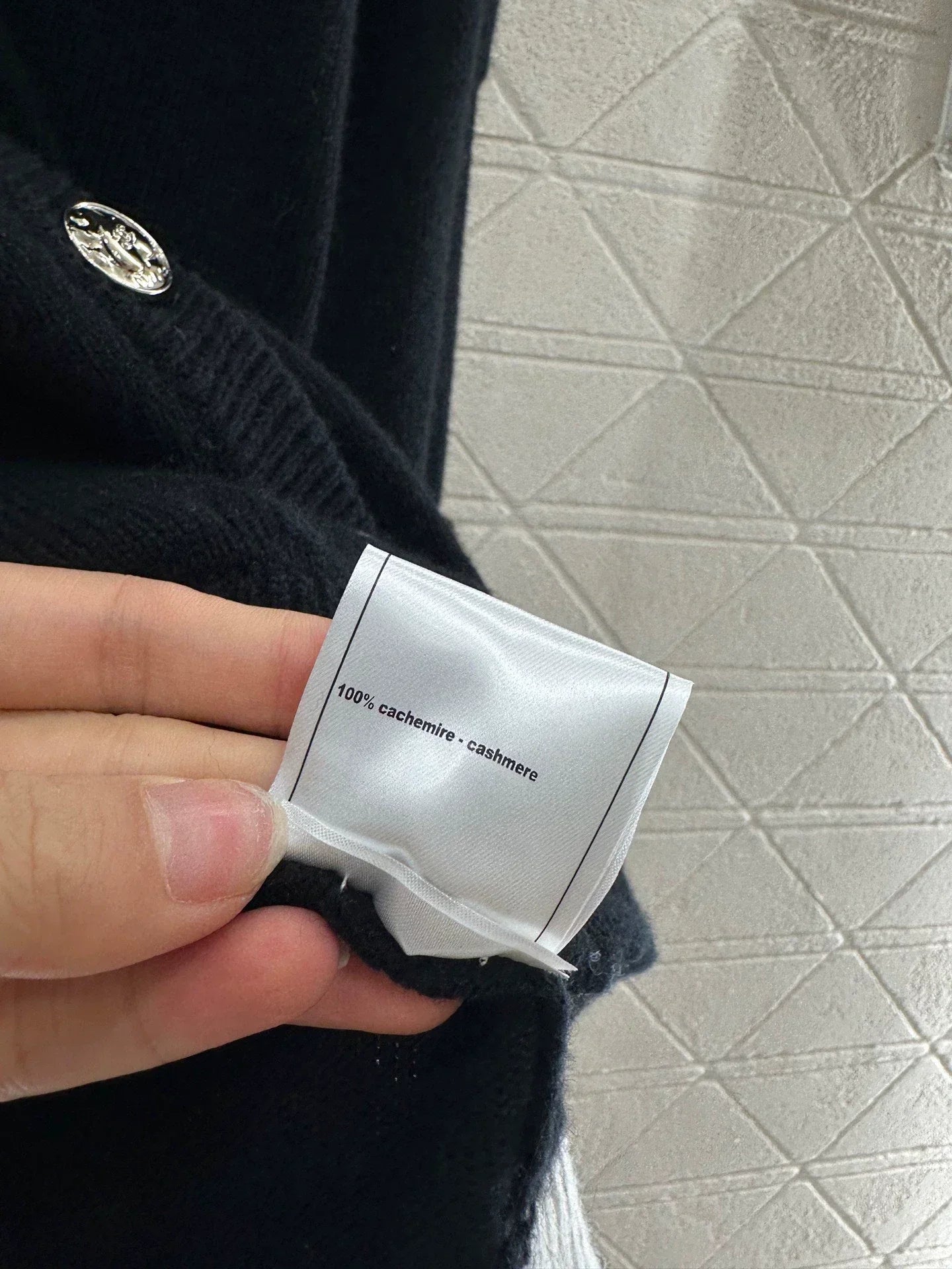 C 25 Multi-button knitted cardigan