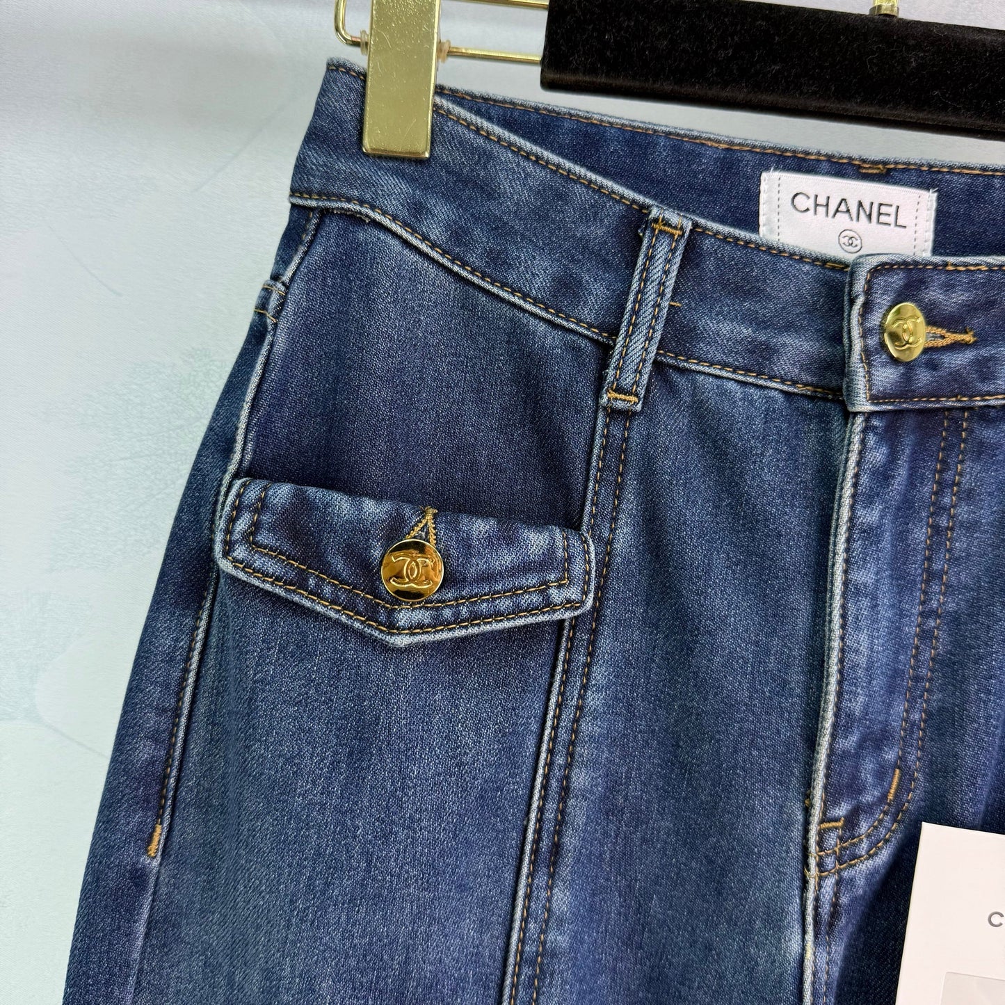 New style straight leg jeans with gold buttons