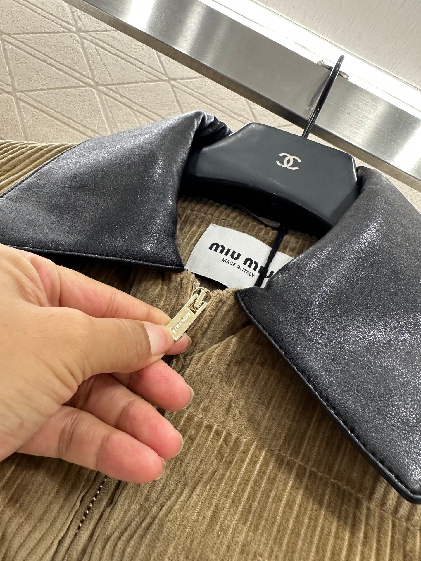 Leather collar corduroy down jacket