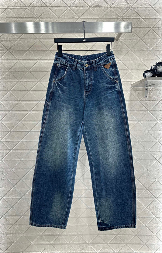 Spliced leather curved knife denim pants