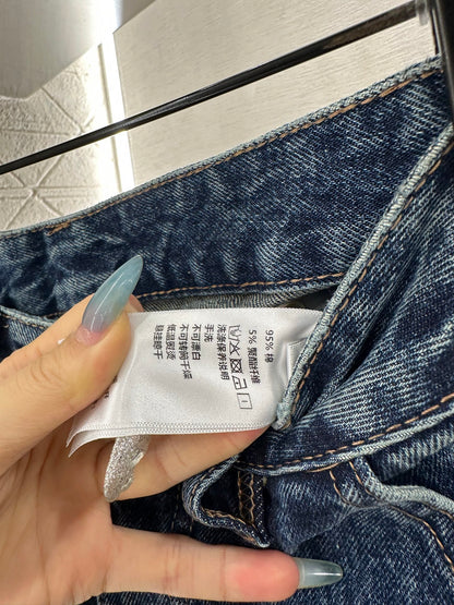 Spliced leather curved knife denim pants