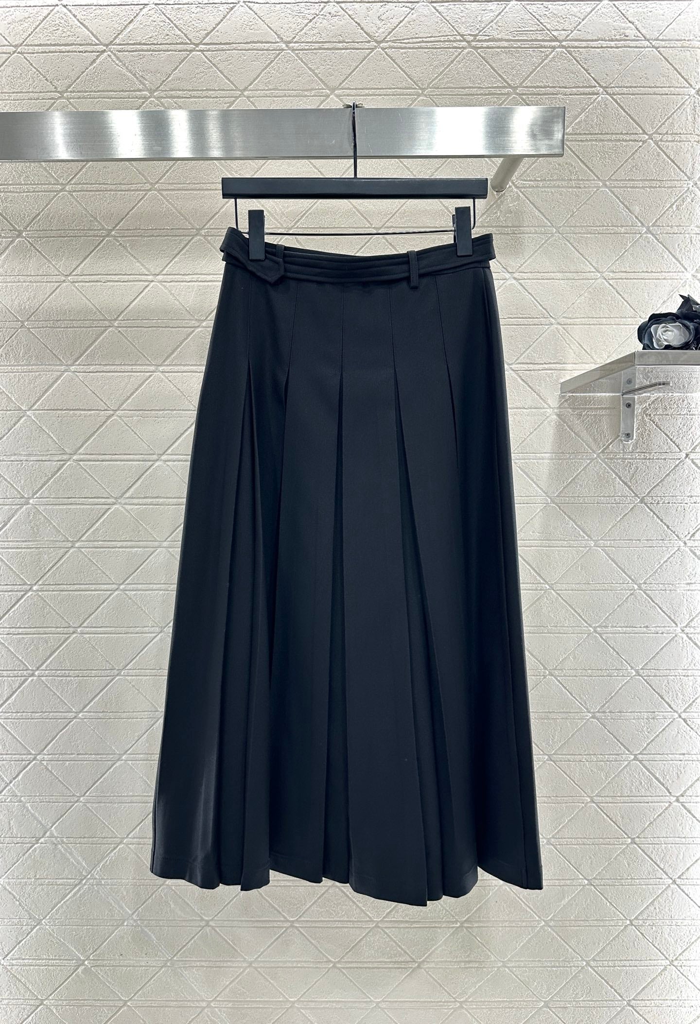 Mid length pleated skirt with waist belt