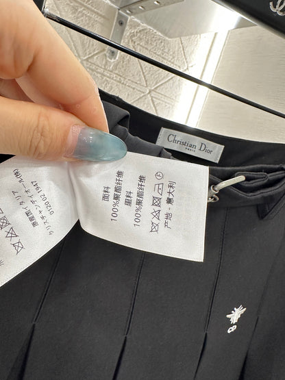 Mid length pleated skirt with waist belt