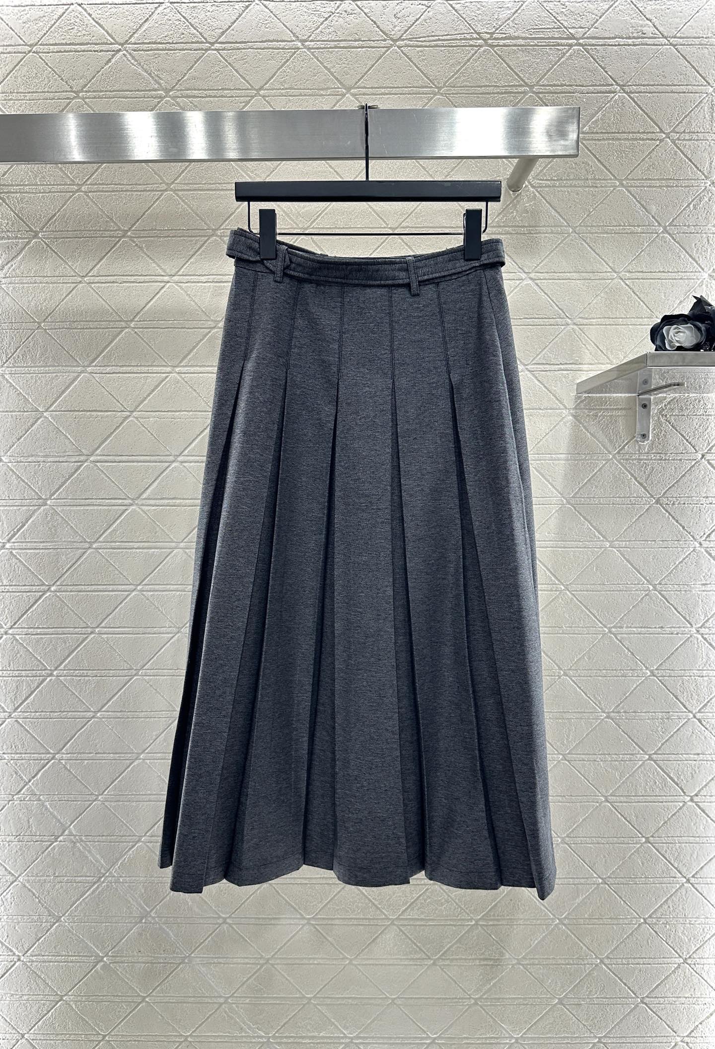 Mid length pleated skirt with waist belt