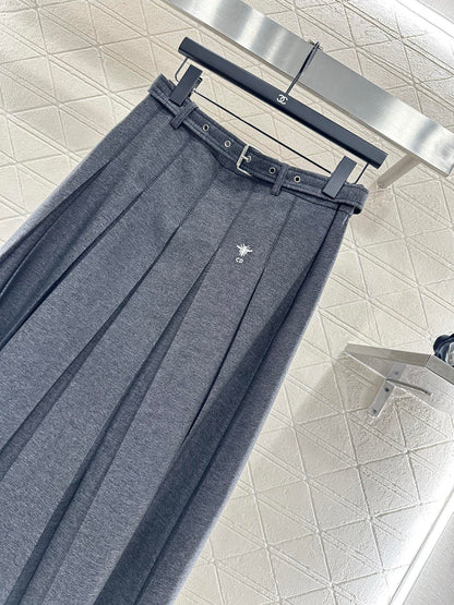 Mid length pleated skirt with waist belt