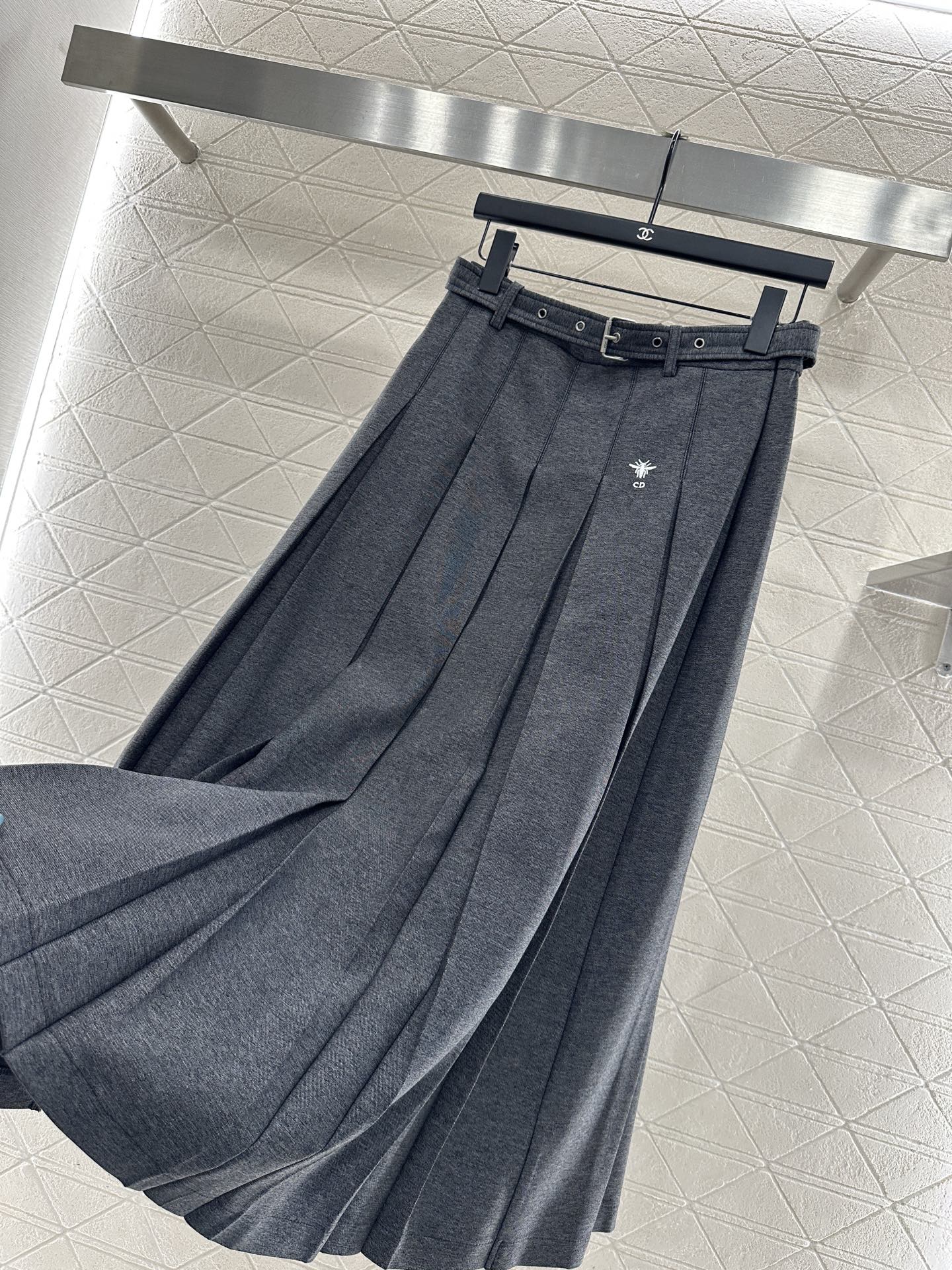 Mid length pleated skirt with waist belt