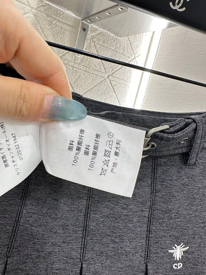 Mid length pleated skirt with waist belt