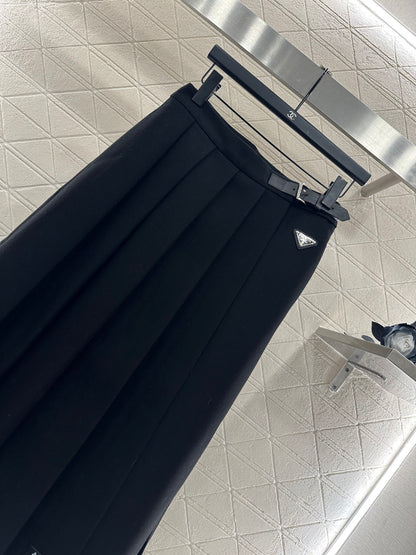 Mid length pleated skirt with waist belt