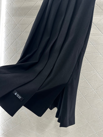 Mid length pleated skirt with waist belt