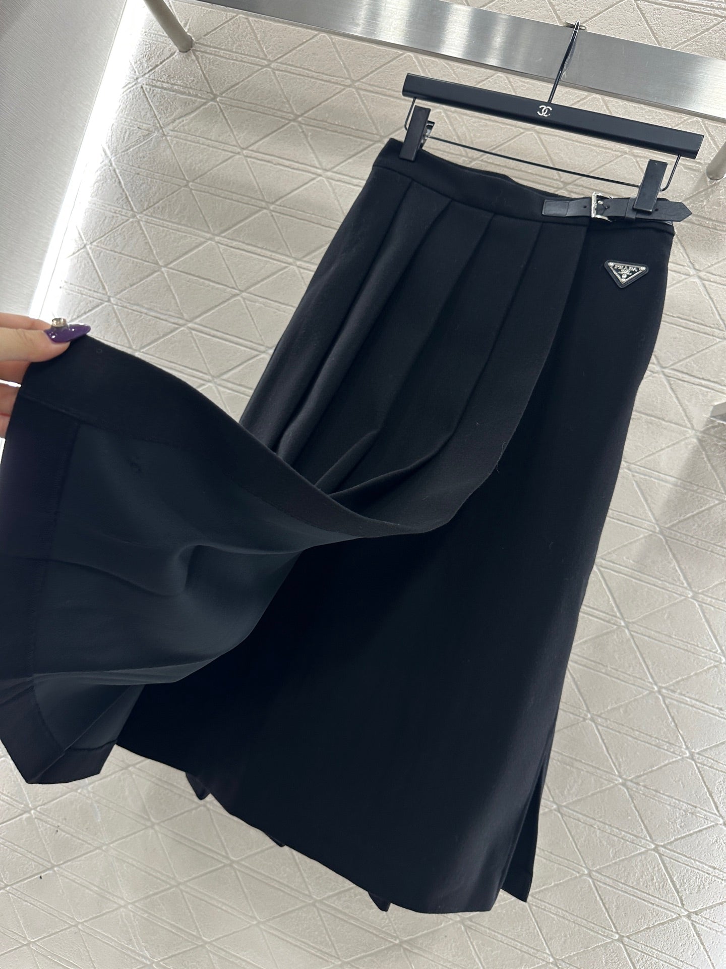 Mid length pleated skirt with waist belt