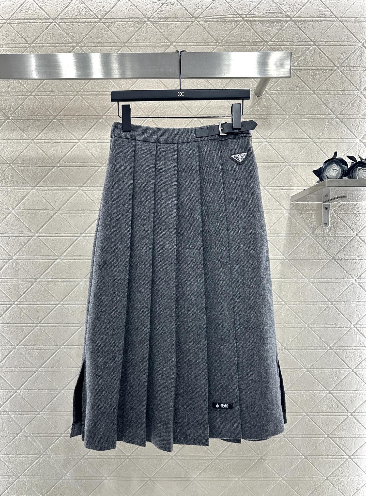 Mid length pleated skirt with waist belt