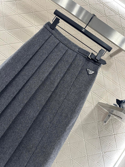 Mid length pleated skirt with waist belt