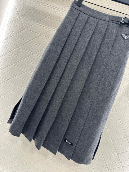 Mid length pleated skirt with waist belt