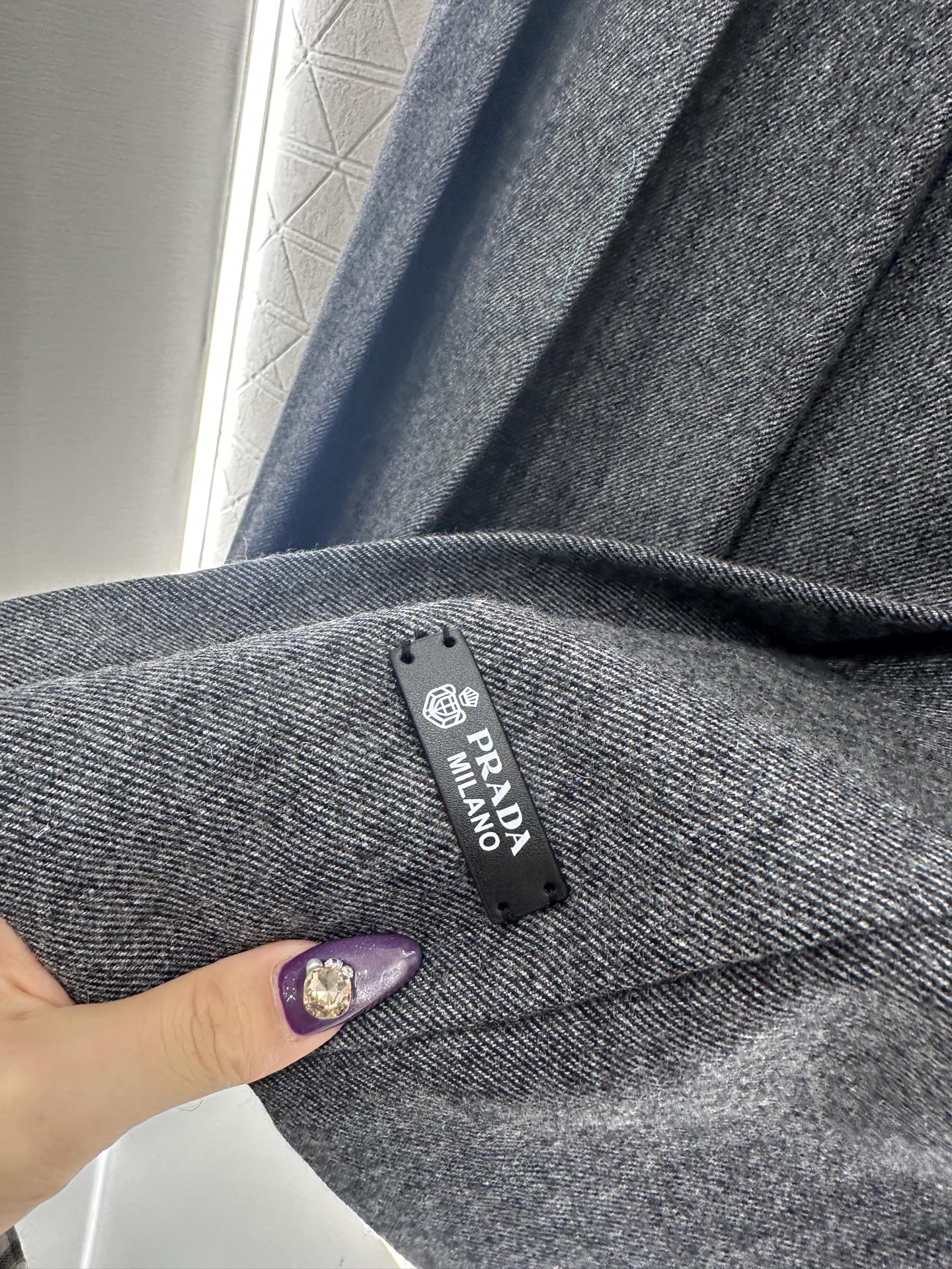 Mid length pleated skirt with waist belt