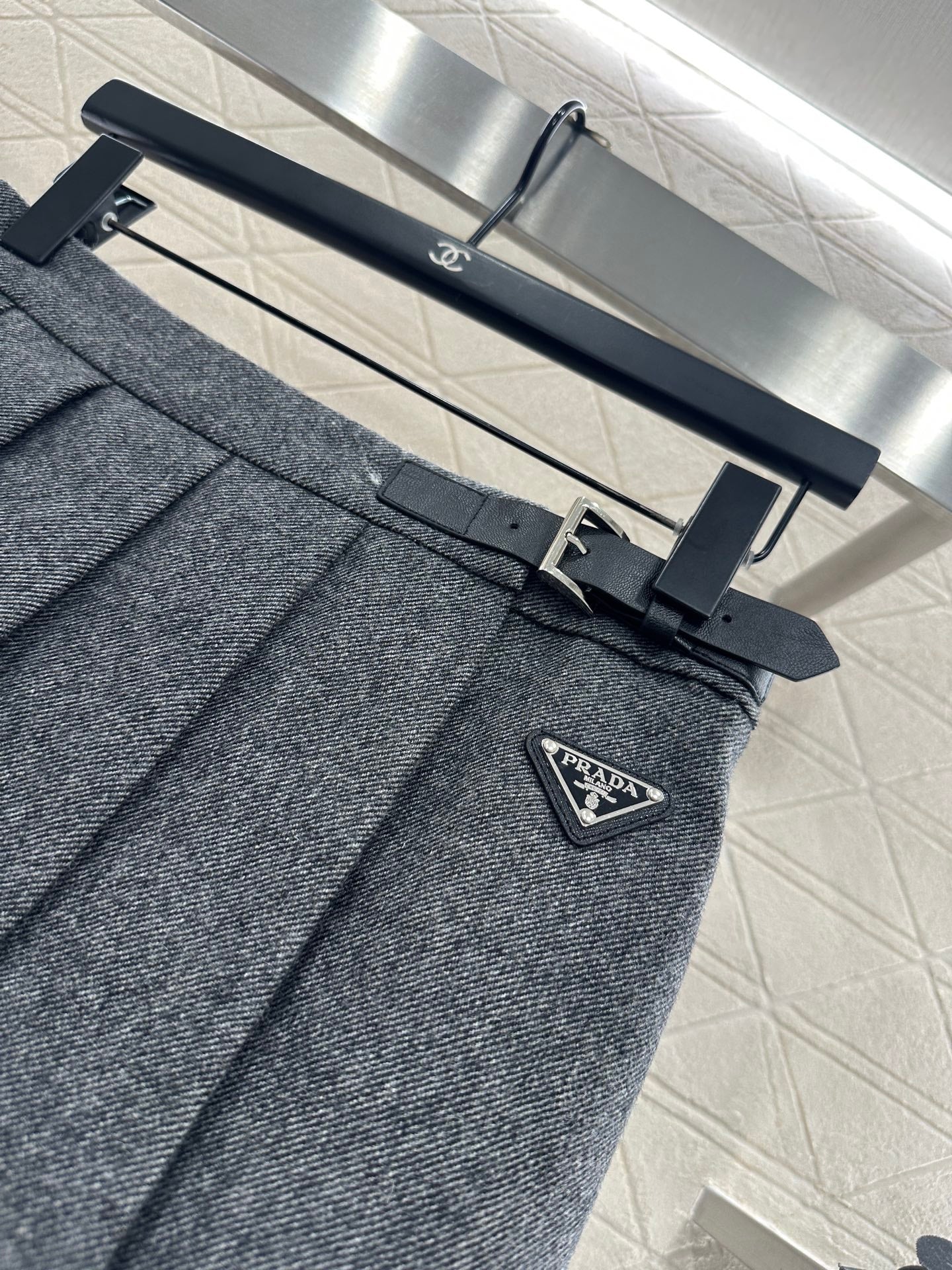 Mid length pleated skirt with waist belt