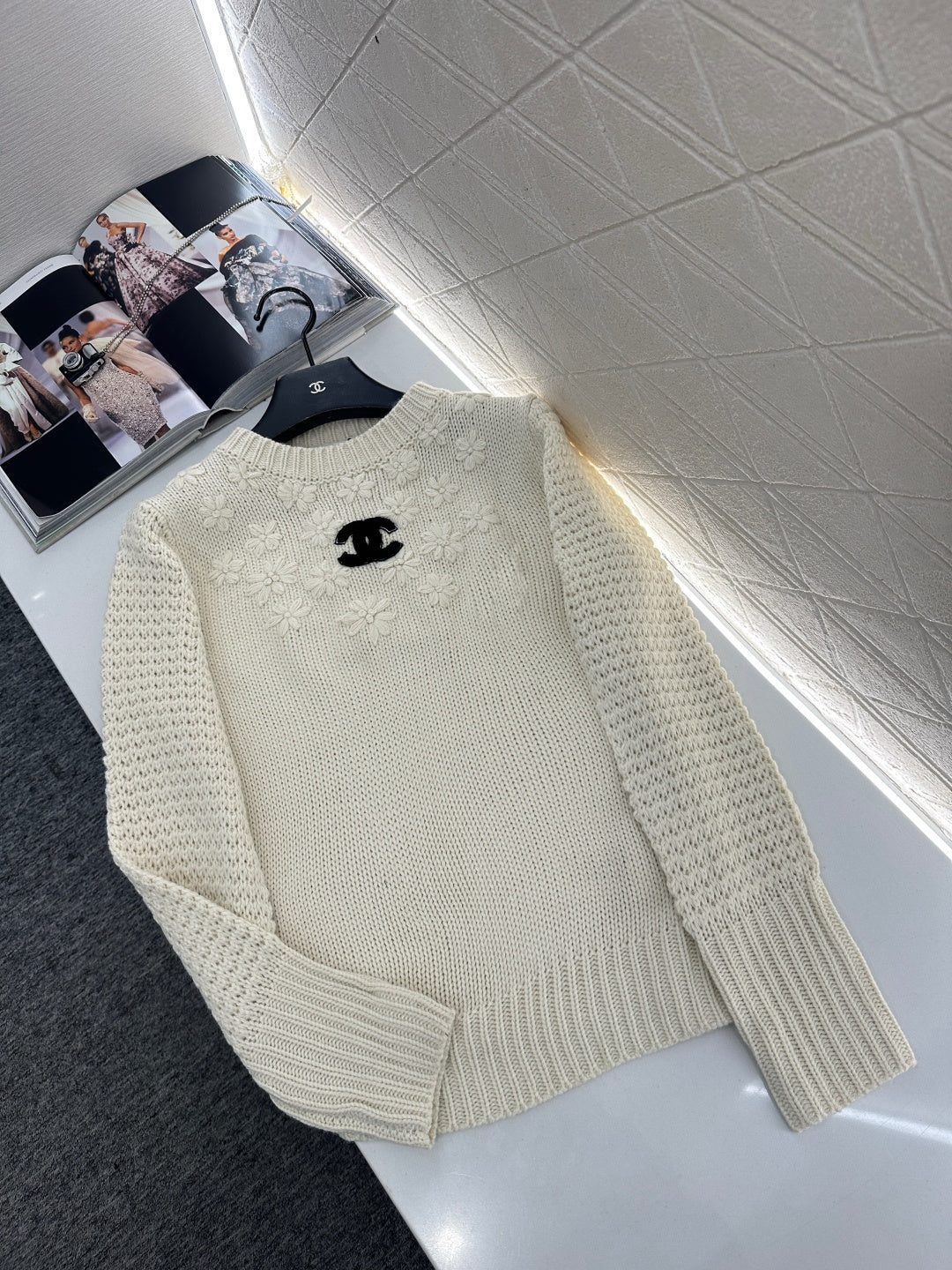 Knitted sweater with hook and loop design