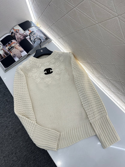 Knitted sweater with hook and loop design