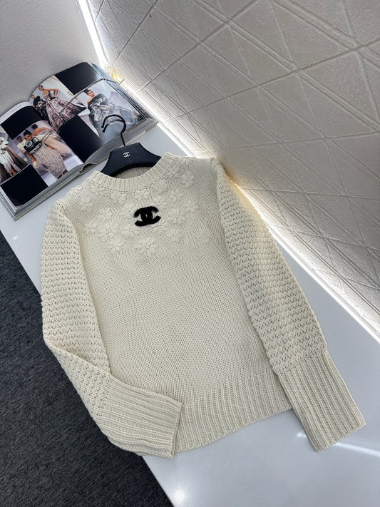 Knitted sweater with hook and loop design