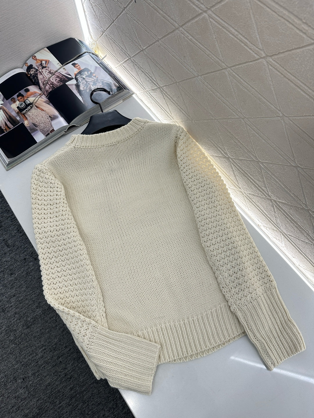 Knitted sweater with hook and loop design