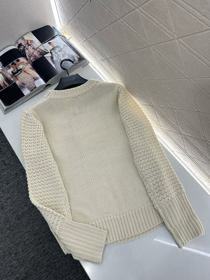Knitted sweater with hook and loop design
