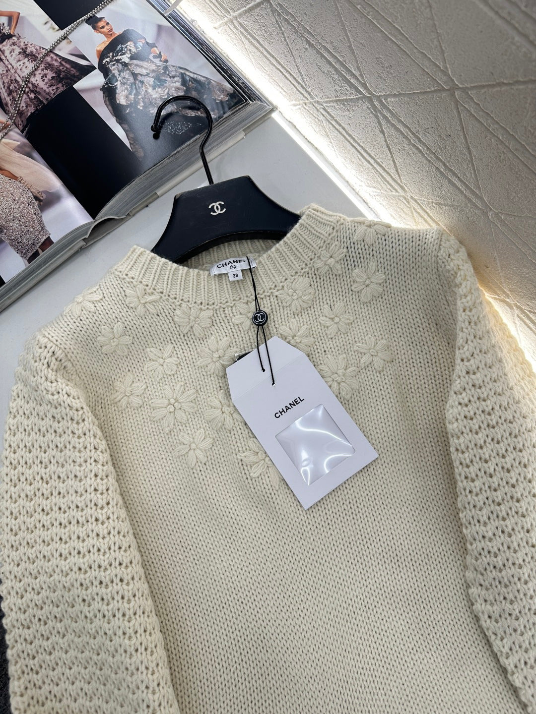 Knitted sweater with hook and loop design