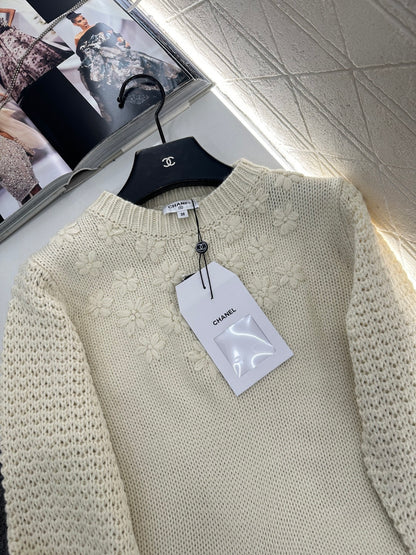 Knitted sweater with hook and loop design