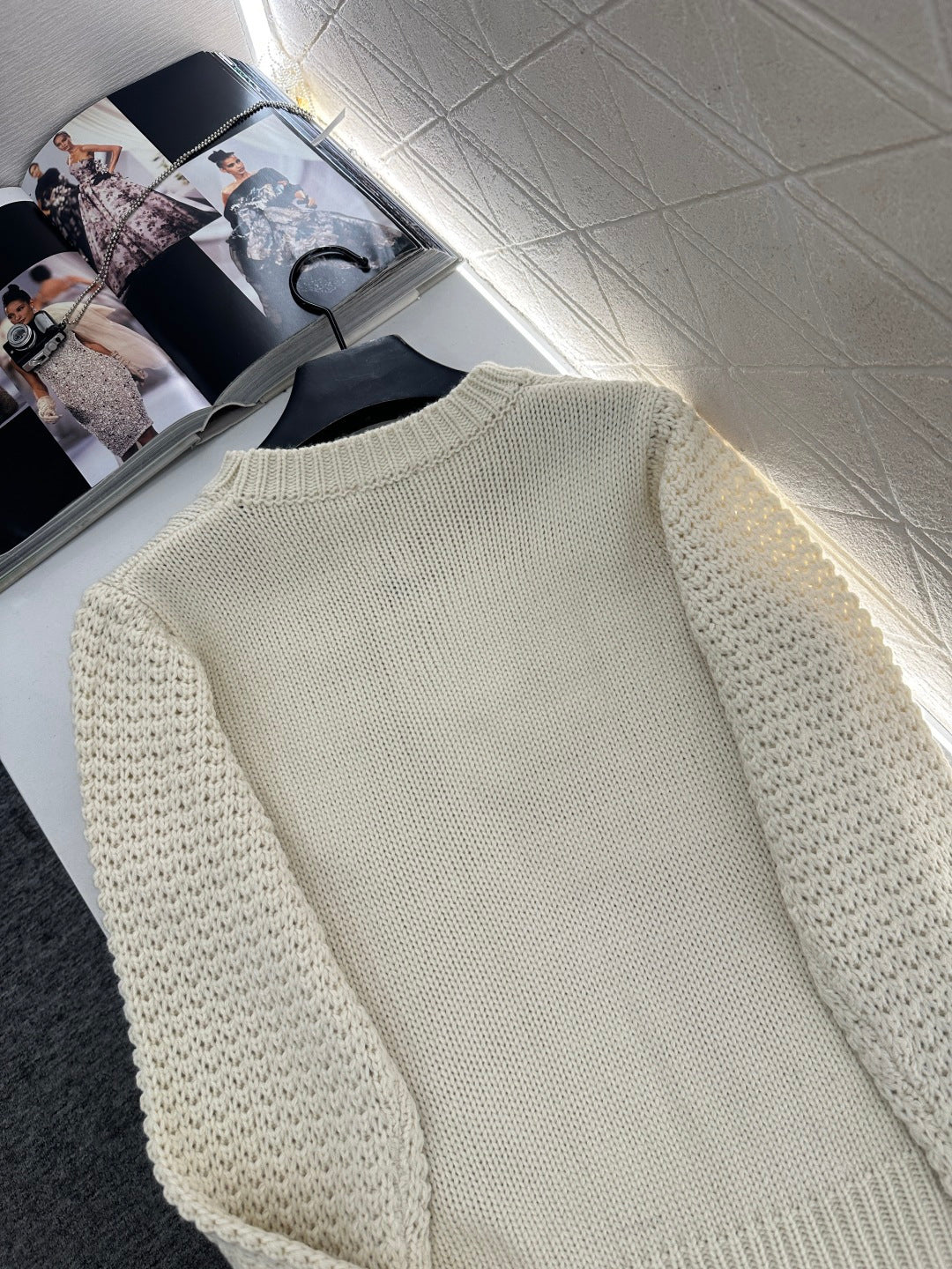 Knitted sweater with hook and loop design
