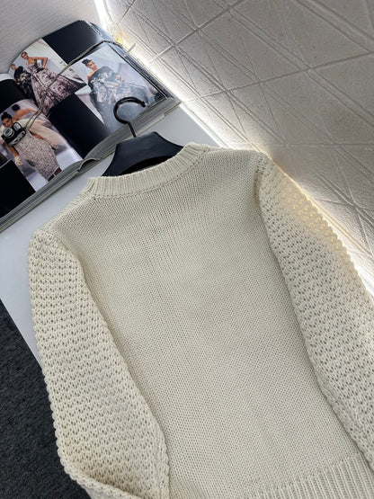 Knitted sweater with hook and loop design