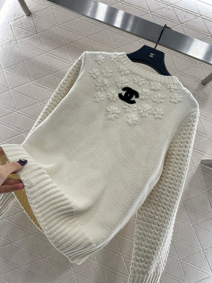 Knitted sweater with hook and loop design