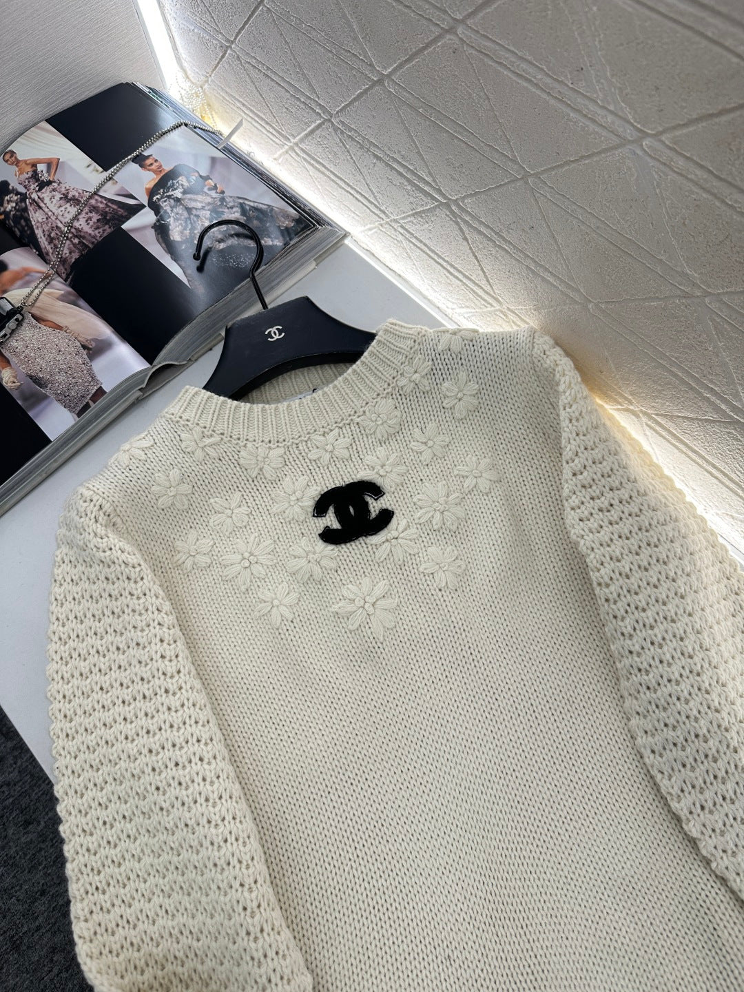 Knitted sweater with hook and loop design