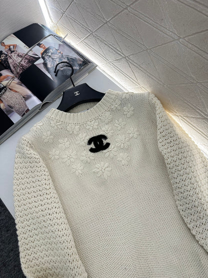 Knitted sweater with hook and loop design