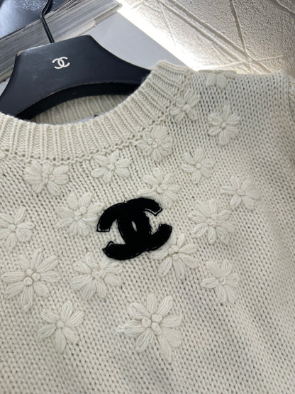 Knitted sweater with hook and loop design