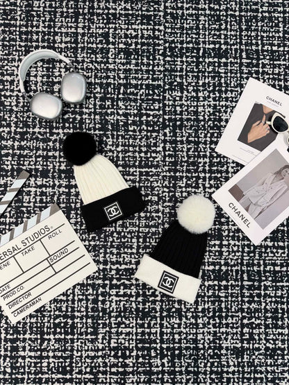 Black and white contrasting ball knitted hat