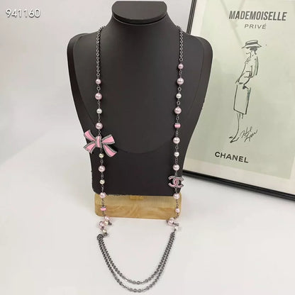 Pink enamel bow pearl sweater chain