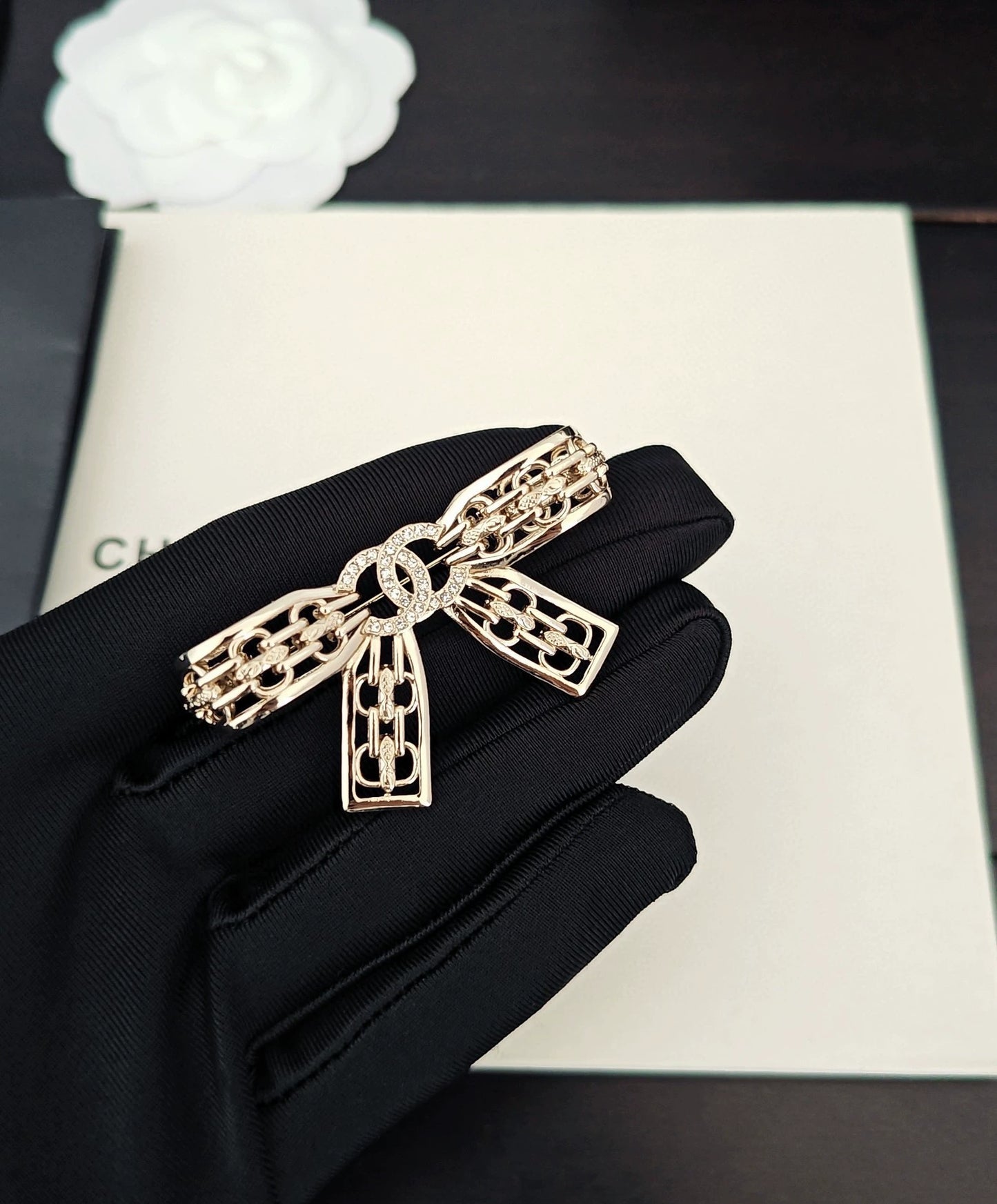 Light gold hollow bow brooch