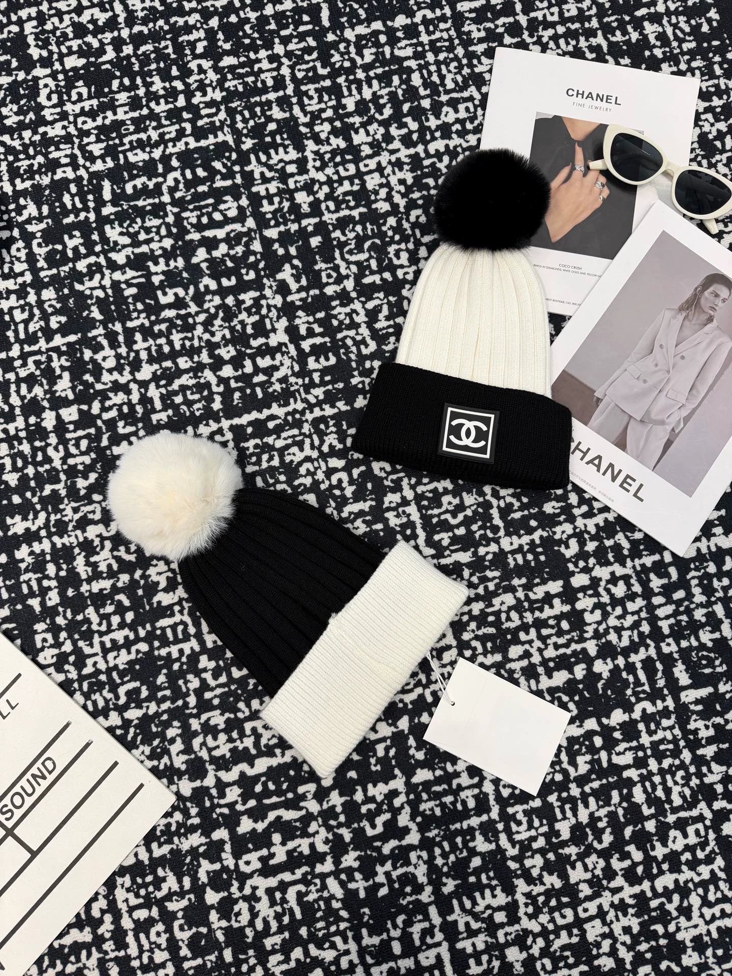 Black and white contrasting ball knitted hat