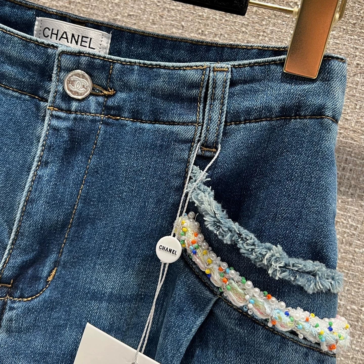 Pearl and rhinestone embellished wide-leg jeans