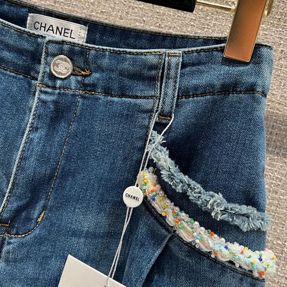 Pearl and rhinestone embellished wide-leg jeans