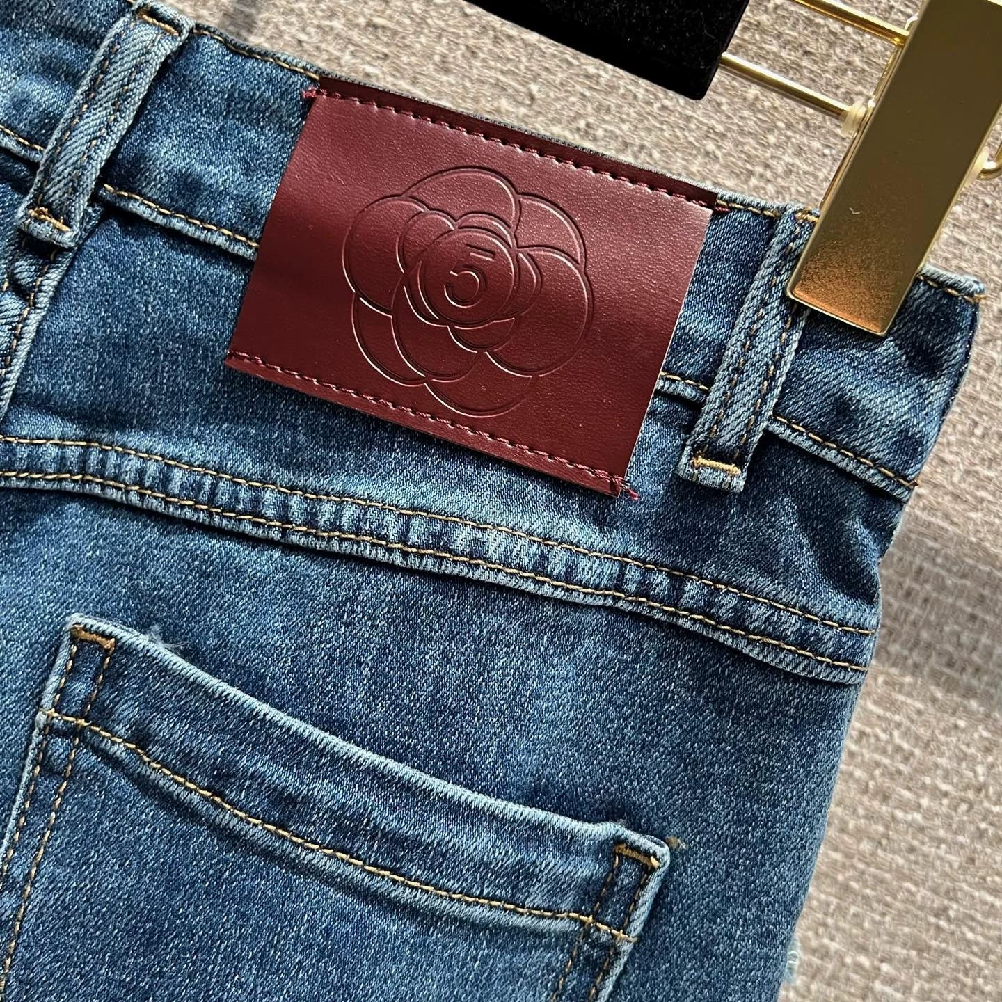 Pearl and rhinestone embellished wide-leg jeans