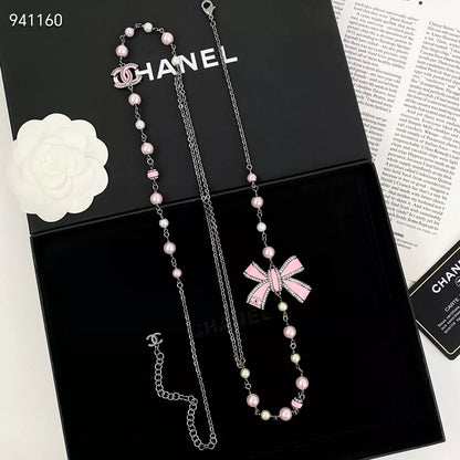 Pink enamel bow pearl sweater chain
