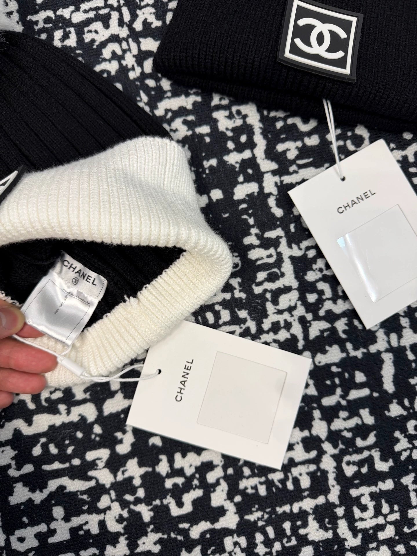 Black and white contrasting ball knitted hat