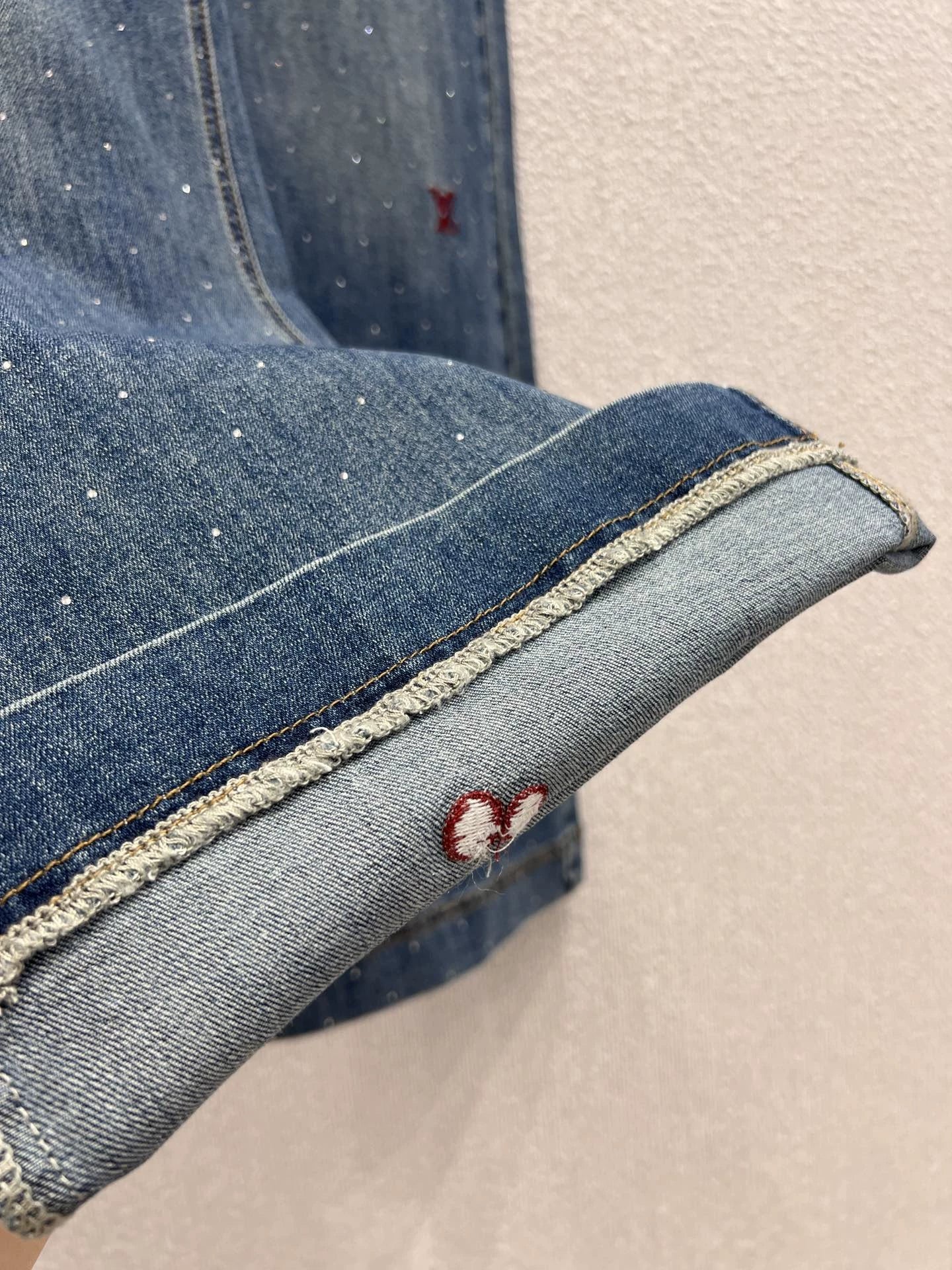 25FW rhinestone logo embroidered denim pants