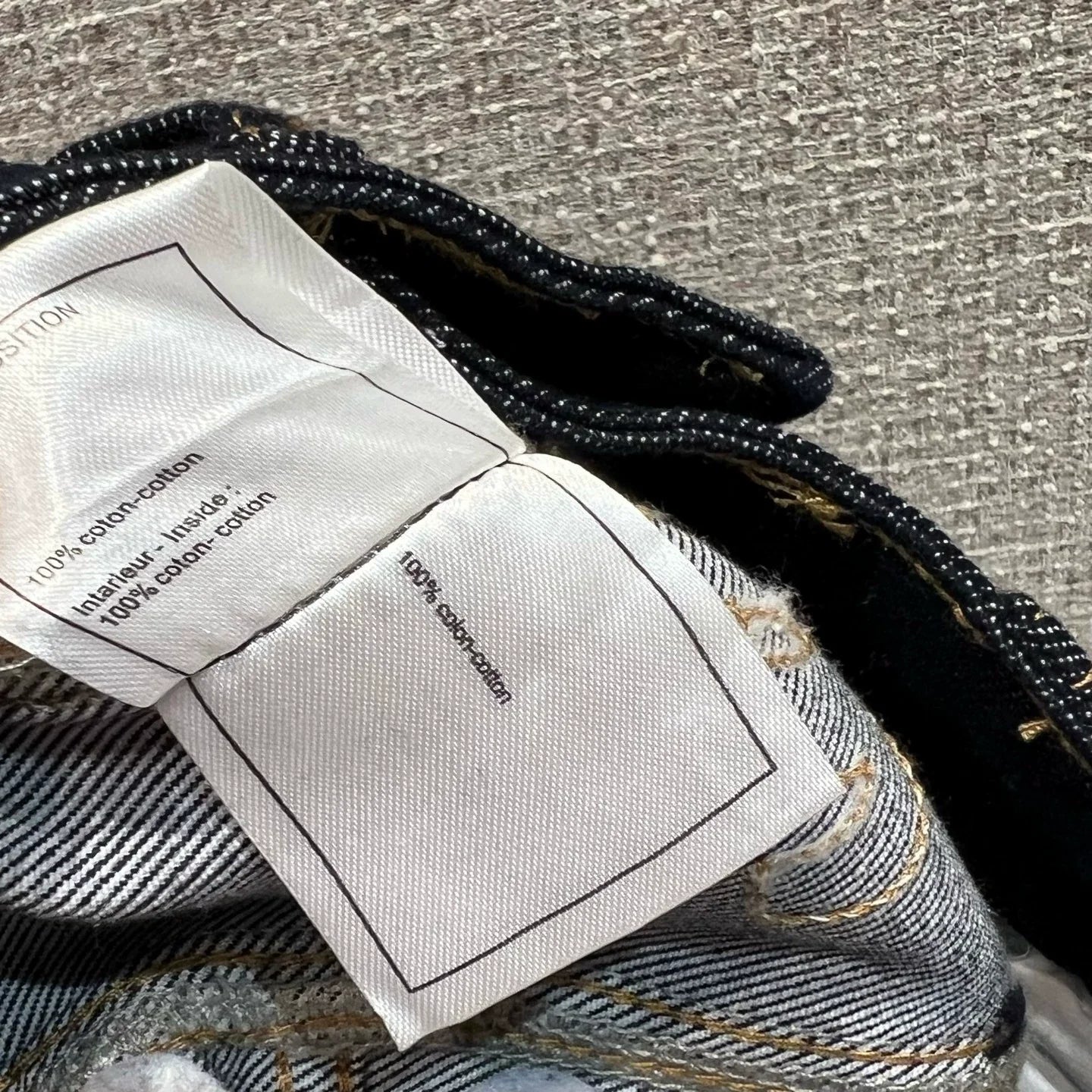 Side-embroidered washed denim jeans