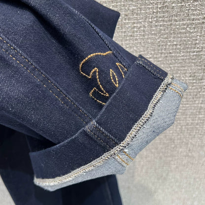 Side-embroidered washed denim jeans