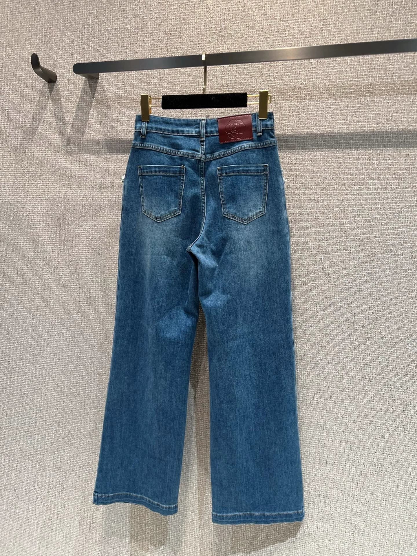 Pearl and rhinestone embellished wide-leg jeans