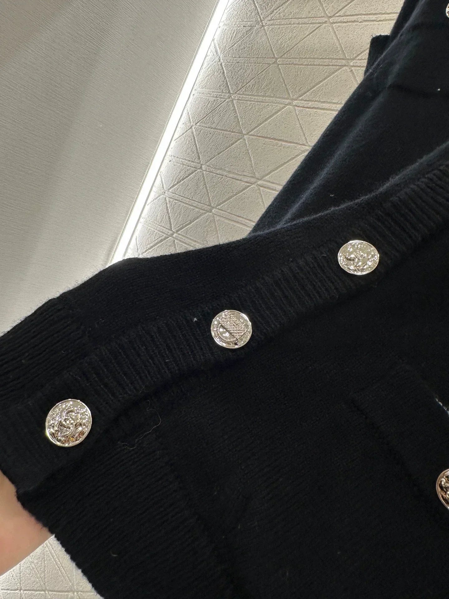 C 25 Multi-button knitted cardigan